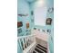 Coastal-themed stairway with unique decorations creating a cheerful descent at 315 Manatee Ln, Tarpon Springs, FL 34689