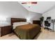 Comfortable bedroom featuring a large bed, ceiling fan, and home office setup at 318 Parkside Ln, Safety Harbor, FL 34695