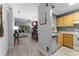 Open-concept living space with a fireplace and a seamless flow into the adjacent kitchen and dining area at 318 Parkside Ln, Safety Harbor, FL 34695