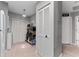 Spacious pantry with louvered doors and shelving for optimal storage, next to in-unit laundry at 318 Parkside Ln, Safety Harbor, FL 34695