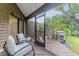 Relaxing screened-in patio with comfortable seating and barbecue grill; perfect for outdoor entertaining at 318 Parkside Ln, Safety Harbor, FL 34695