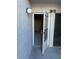 Basement storage area with open door at 329 Medallion Blvd # C, Madeira Beach, FL 33708