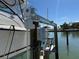Boat lift with stairs ready to lift your boat out of the water after a long day of fishing at 329 Medallion Blvd # C, Madeira Beach, FL 33708
