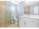 Contemporary bathroom with walk-in shower, sleek vanity, and modern fixtures at 330 176Th Avenue Cir, Redington Shores, FL 33708