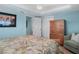 Bedroom includes wardrobe, ceiling fan, and easy access to the attached Primary bathroom at 330 176Th Avenue Cir, Redington Shores, FL 33708