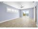 Bright bedroom with tile flooring and sliding glass door with serene water views at 330 176Th Avenue Cir, Redington Shores, FL 33708