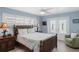 Bedroom featuring plantation shutters and access to lanai at 330 176Th Avenue Cir, Redington Shores, FL 33708