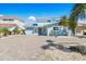 Charming home with a neatly paved driveway, tropical landscaping, and a serene, inviting curb appeal at 330 176Th Avenue Cir, Redington Shores, FL 33708