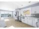Bright open kitchen features waterfront views, stainless steel appliances, and modern finishes at 330 176Th Avenue Cir, Redington Shores, FL 33708