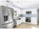 Updated kitchen with stainless steel appliances and white cabinets for a modern feel at 330 176Th Avenue Cir, Redington Shores, FL 33708