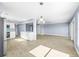 Open concept living space with tiled floors seamlessly connects to the kitchen area at 330 176Th Avenue Cir, Redington Shores, FL 33708