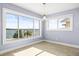 Bright room with large windows showcasing beautiful waterfront views and tile flooring at 330 176Th Avenue Cir, Redington Shores, FL 33708