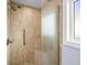 Walk-in shower with tile surround and shower bench at 330 176Th Avenue Cir, Redington Shores, FL 33708