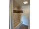 The tub and shower combo with white and brown tiling in a full bathroom creates a clean and refreshing place to unwind at 3718 19Th S Ave, St Petersburg, FL 33711