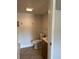 A functional bathroom is equipped with standard fixtures, including a toilet, vanity, and shower-tub combo, all set in neutral tones at 3718 19Th S Ave, St Petersburg, FL 33711
