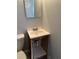 A compact bathroom features a single vanity with open storage, complemented by neutral walls and standard toilet at 3718 19Th S Ave, St Petersburg, FL 33711