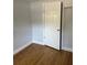 A simple bedroom with hardwood floors and a single closet, offering a cozy space with essential storage solutions at 3718 19Th S Ave, St Petersburg, FL 33711
