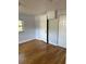 Bright bedroom featuring hardwood floors and a double closet to maximize storage space and functionality at 3718 19Th S Ave, St Petersburg, FL 33711