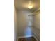 A walk-in closet features wire shelving, providing practical and visible storage solutions within a compact space at 3718 19Th S Ave, St Petersburg, FL 33711