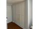 Built in storage unit featuring white doors, stained floors, and grey walls at 3718 19Th S Ave, St Petersburg, FL 33711