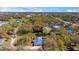 Overhead view showcases a beautiful home with pool, complemented by the surrounding greenery and neighborhood at 37350 Neighbors Path, Zephyrhills, FL 33542