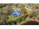 Aerial of home showing a screened-in pool and large yard at 37350 Neighbors Path, Zephyrhills, FL 33542