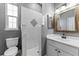 A full bathroom with a single vanity, toilet and tiled standing shower at 37350 Neighbors Path, Zephyrhills, FL 33542