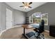 Bedroom with hardwood floors, ceiling fan, and a large window at 37350 Neighbors Path, Zephyrhills, FL 33542