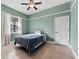 Bedroom featuring a ceiling fan, natural light, and wood flooring at 37350 Neighbors Path, Zephyrhills, FL 33542