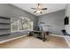 Bedroom with hardwood floors, ceiling fan, and large window with views at 37350 Neighbors Path, Zephyrhills, FL 33542