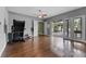 Bonus room features wood floors and french doors to an outdoor space at 37350 Neighbors Path, Zephyrhills, FL 33542