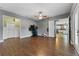 Bonus room with exercise equipment and views into the kitchen at 37350 Neighbors Path, Zephyrhills, FL 33542