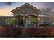 Home featuring manicured front yard and a welcoming front entryway at 37350 Neighbors Path, Zephyrhills, FL 33542