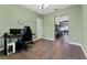 Office area with a view of the kitchen, natural lighting, and tile floors at 37350 Neighbors Path, Zephyrhills, FL 33542