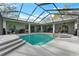 Bright and inviting screened-in pool with a built-in spa and beautiful patio area at 37350 Neighbors Path, Zephyrhills, FL 33542
