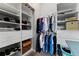 A closet features a section for hanging clothes and built in drawers at 37350 Neighbors Path, Zephyrhills, FL 33542