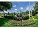 Scenic Ridgemoor Central Park featuring a residents-only tennis court and meticulously maintained landscaping at 3798 Darston St, Palm Harbor, FL 34685