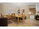Elegant dining room featuring travertine tile flooring, a modern chandelier, and neutral paint at 3798 Darston St, Palm Harbor, FL 34685