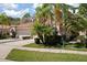 Beautiful home with a tile roof, manicured landscaping, and an attached two-car garage at 3798 Darston St, Palm Harbor, FL 34685