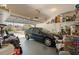 Organized garage featuring an automobile and plenty of storage and bright natural light at 3798 Darston St, Palm Harbor, FL 34685