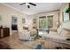 Inviting living room with sliding doors to the patio, comfortable seating, and neutral paint at 3798 Darston St, Palm Harbor, FL 34685