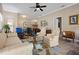 Cozy living room with comfortable seating, a ceiling fan, and neutral paint at 3798 Darston St, Palm Harbor, FL 34685