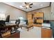 Well-lit home office featuring custom built-ins, desk, neutral walls and ceilings, and comfortable seating area at 3798 Darston St, Palm Harbor, FL 34685