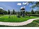 Charming community playground featuring slides, climbing structures, and a lush grassy play area at 3798 Darston St, Palm Harbor, FL 34685