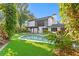 An inviting pool and pergola enhance the home's backyard, perfect for outdoor entertaining and relaxation at 4308 W Beach Park Dr, Tampa, FL 33609