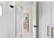 Modern bathroom with glass shower featuring white tile at 4308 W Beach Park Dr, Tampa, FL 33609