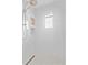 Contemporary bathroom features a rainfall shower head, black and white floor tiles, and marble wall tiles at 4308 W Beach Park Dr, Tampa, FL 33609