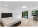 Spacious bedroom with access to the pool and modern accents at 4308 W Beach Park Dr, Tampa, FL 33609