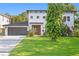 Beautiful two story home features a well maintained lawn, fresh landscaping and a two car garage at 4308 W Beach Park Dr, Tampa, FL 33609