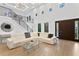 Bright and airy living room with soaring ceilings, iron stairway and oversized windows at 4308 W Beach Park Dr, Tampa, FL 33609